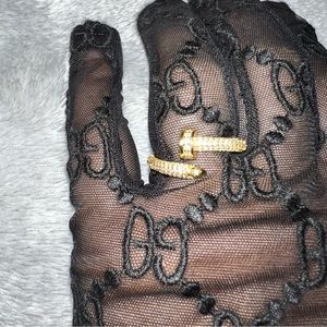 Adjustable Yellow Gold plated nail ring with cubic zirconia diamonds.